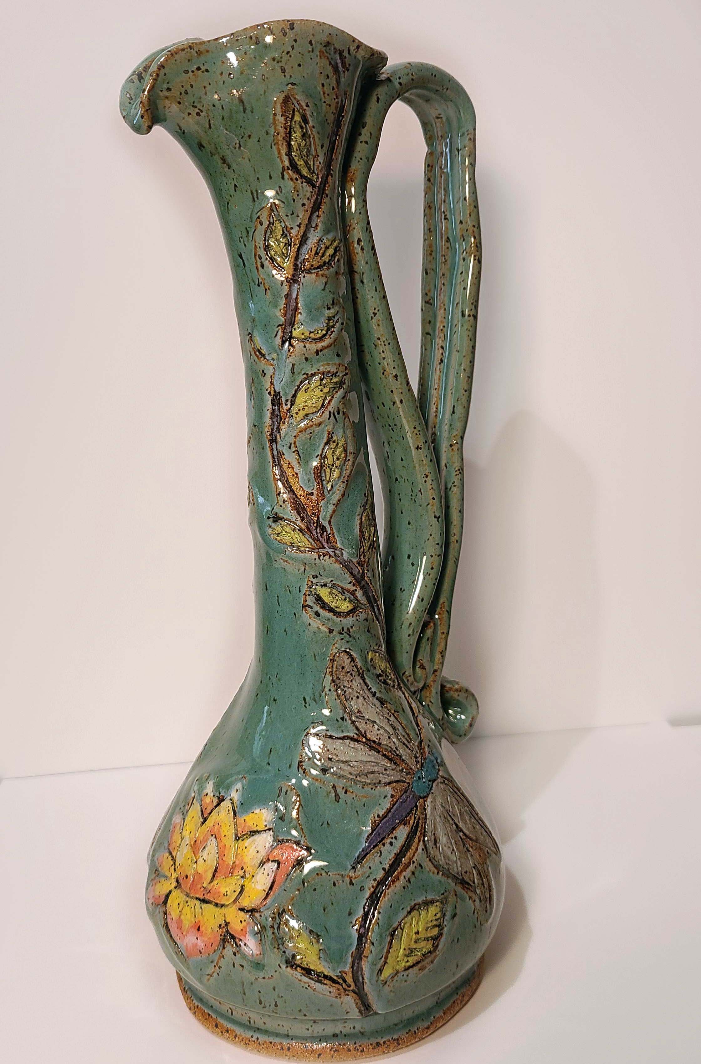 Tall Dragonfly Ceramic Pitcher: Tall ceramic pitcher with dragonfly motif.